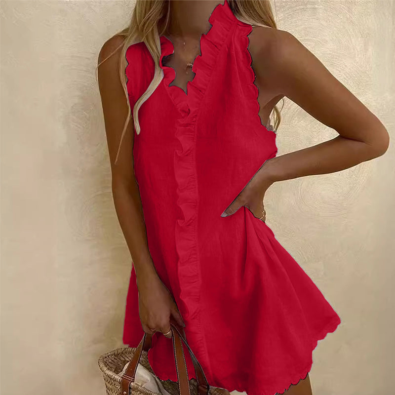 Short-sleeved dress with ruffle and tie details at the front.