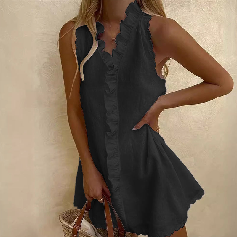 Short-sleeved dress with ruffle and tie details at the front.